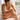 Woman moisturizing her legs before a self-tanning routine