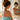 Woman checking her self-tan in natural light before a touch-up routine