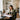 Spray tan business owner reviewing paperwork in a professional studio